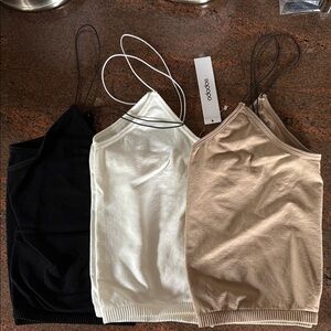 Black, White and tan bralettes